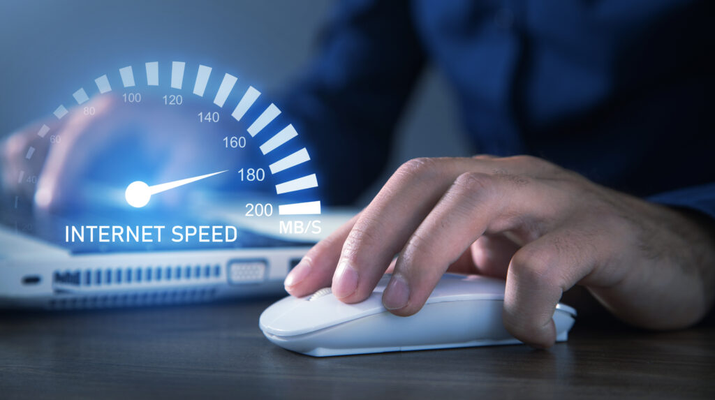  A hand operating a computer mouse with a futuristic internet speedometer graphic, showcasing a fast connection of up to 200 Mbps. This is a perfect representation of high-tech tools used to test my speed for internet performance.