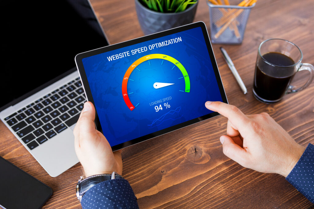  A person using a tablet to analyze website speed optimization, with a gauge indicating a loading speed of 94%. This image is great for illustrating tools that let users easily test my speed for websites or online platforms.