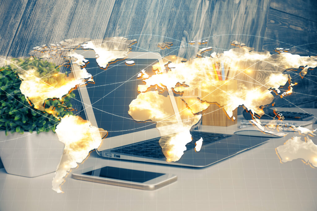 A laptop and smartphone on a desk, overlaid with a world map, symbolizing "what is latency in internet" and how geographical distance impacts connection speed.