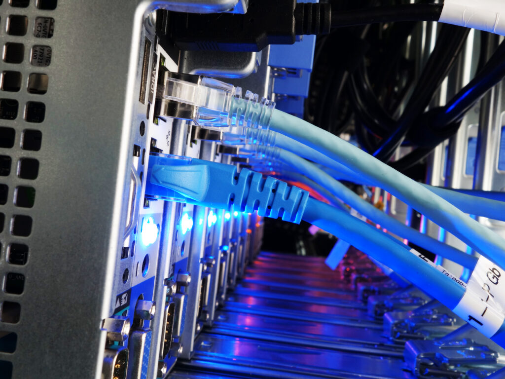 A detailed close-up of fiber optic cables connected to a high-performance server, emphasizing the reliability and high-speed capacity of fiber internet technology.