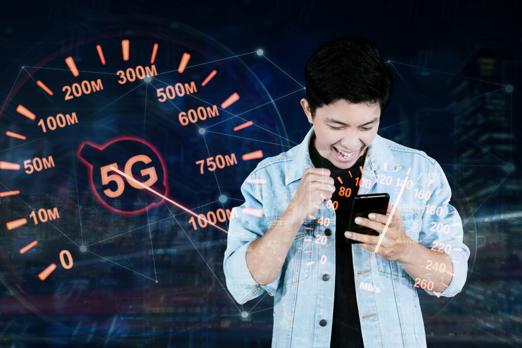 A young man excitedly using a smartphone, with a virtual display of 5G network speeds in the background, emphasizing the potential of high-speed internet connections.